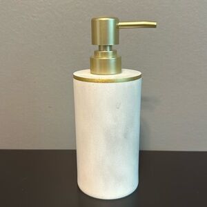 7” lotion/soap dispenser. Marble-like finish with gold accents. Ceramic/metal